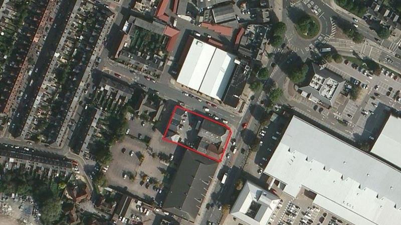 Aerial view of the property outlined in red