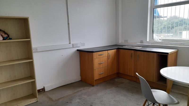Potential kitchen/rest area or ideal for storage or work area
