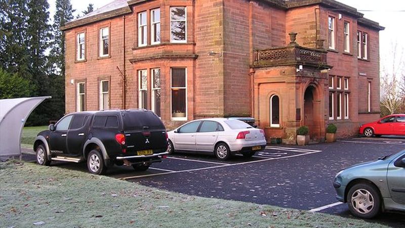 Front elevation with car park and cycle shelter